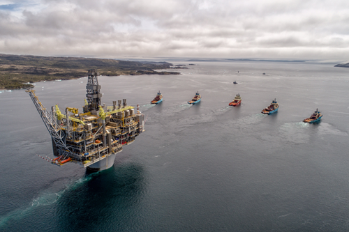 The Hebron platform is towed to its final location. 